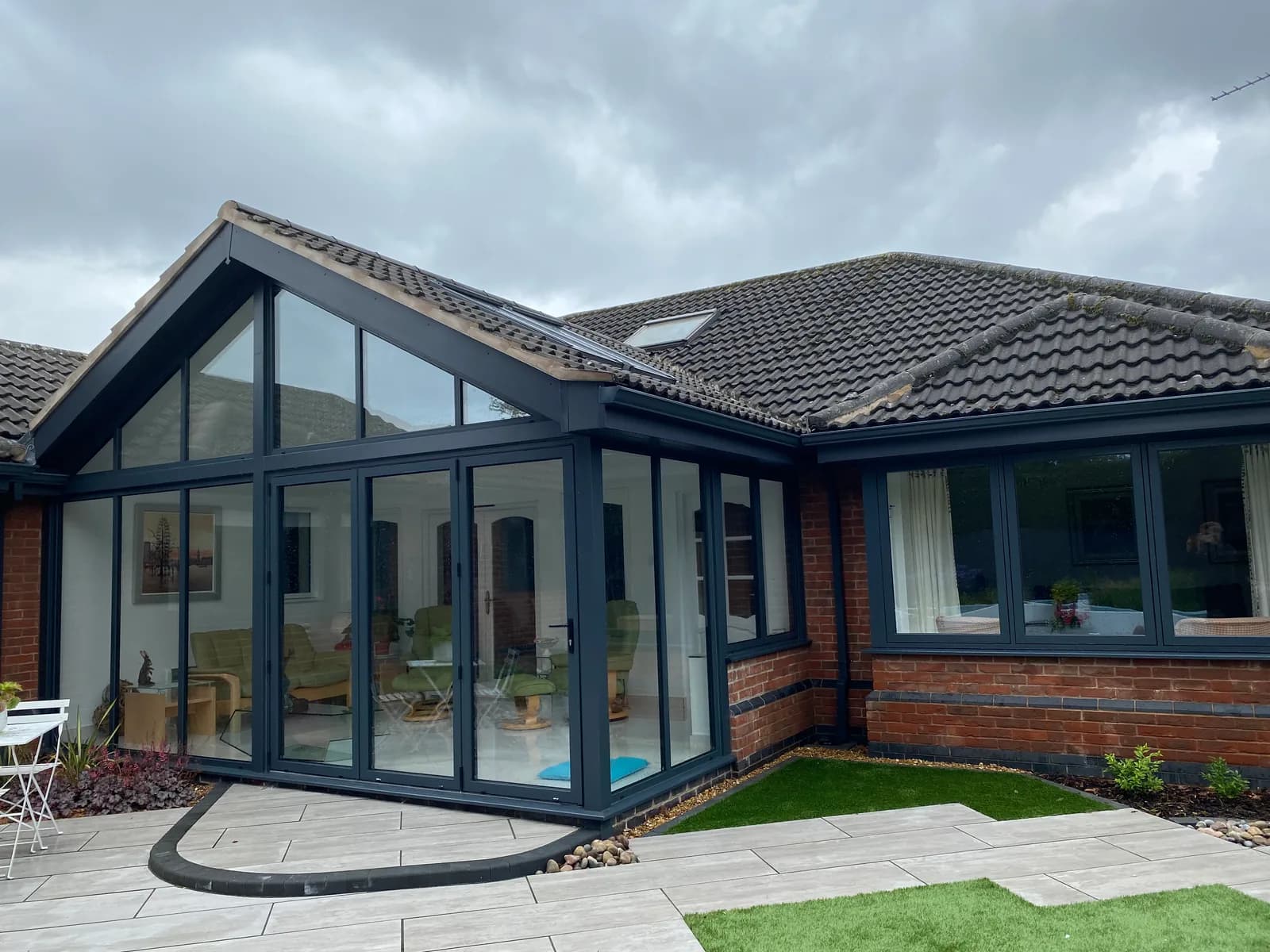 A large glazed garden room with clean glass throughout